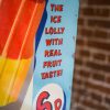 Pair of Tin Lolly Advertising Plates close-up